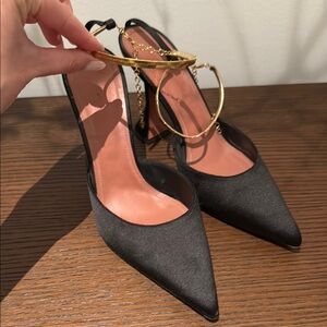 Amina Muaddi Black and Gold Heels with Elegant Design